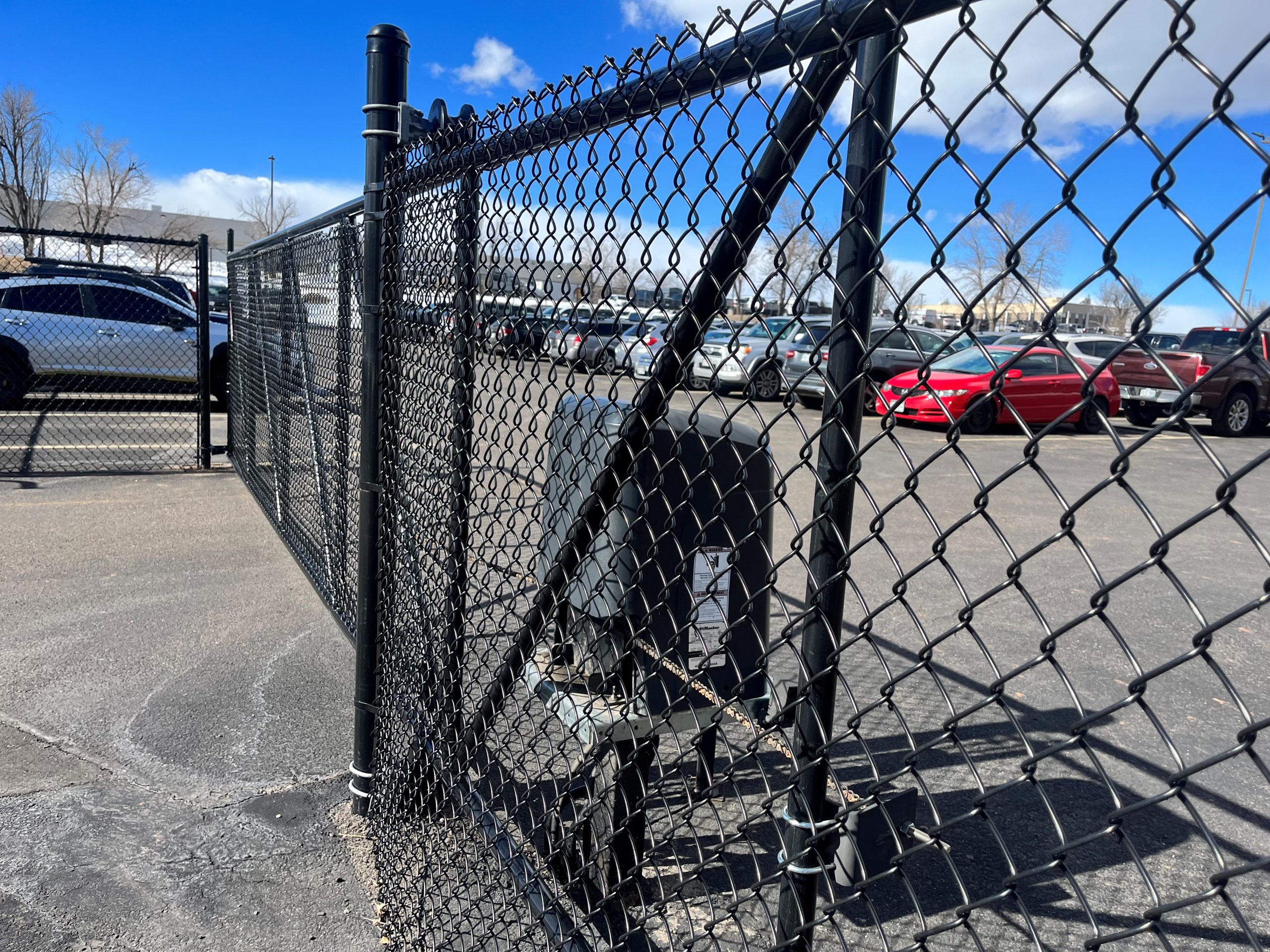 High-security commercial gate and fence system protecting Denver facility
