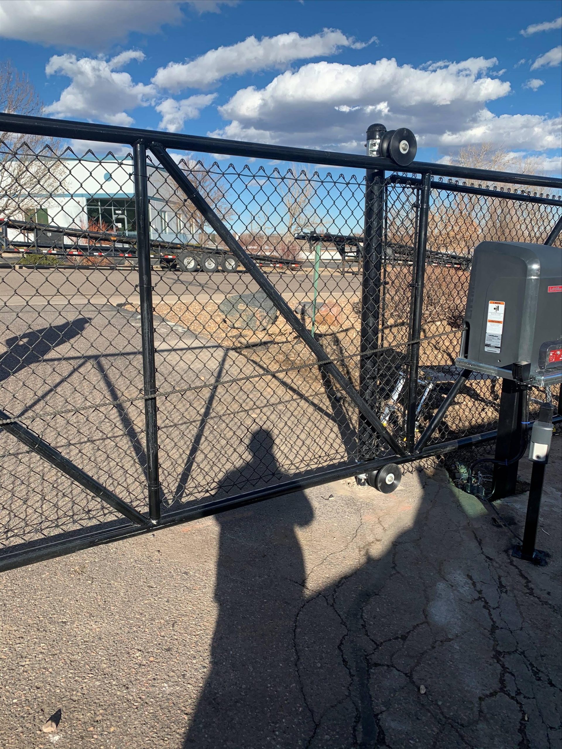 Commercial wire mesh security gate installation at a Denver area property