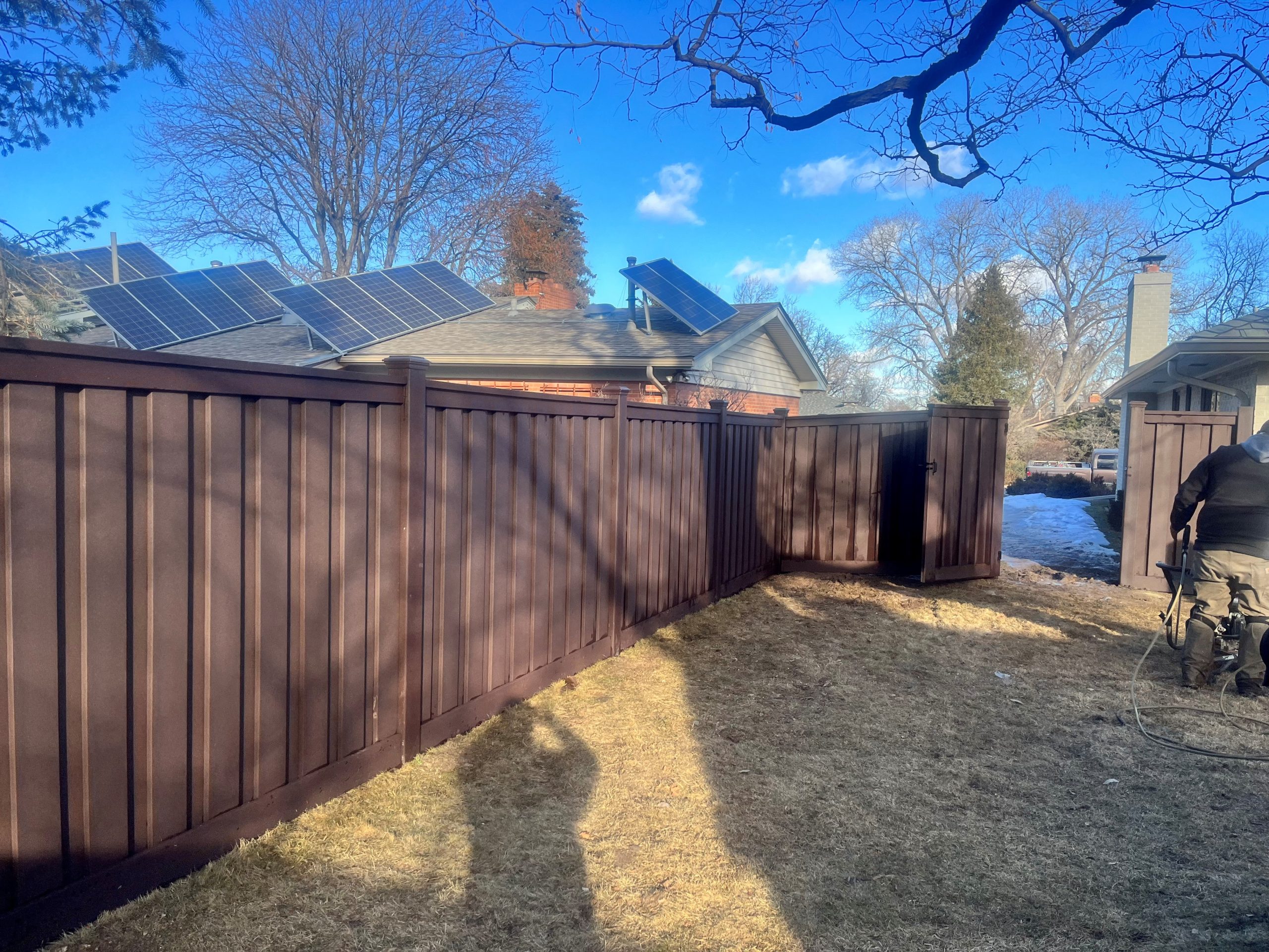 Fence installation in progress with crew building wood privacy fence in Denver neighborhood