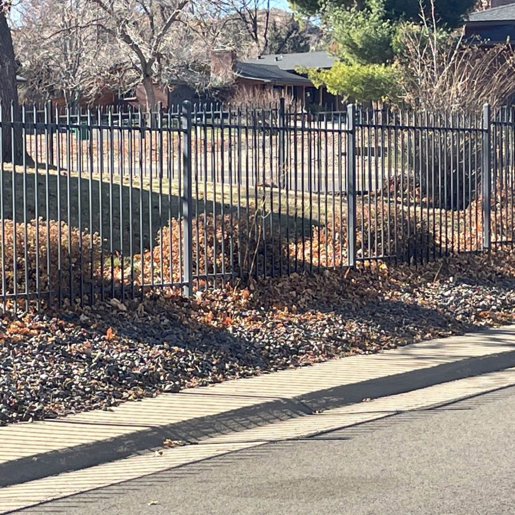 Finished steel ornamental fence installation at a residential property in Lakewood CO